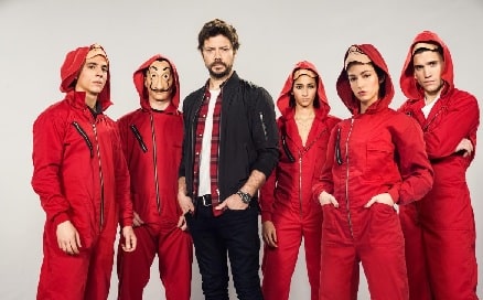 A picture of Jaime Lorente as Denver in Money Heist with other cast members.
